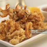 "Delicious fried calamari, with both tentacles and rings, served with cocktail sauce.Vertical:"